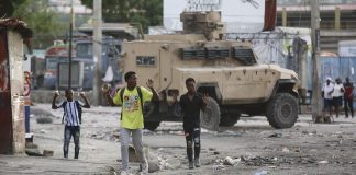 Gunfire paralyzes Haiti as police, powerful gang leader fight Gunfire paralyzes Haiti as police, powerful gang leader fight