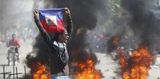 Haiti declares curfew as it tries to restore order after weekend jailbreak Haiti declares curfew as it tries to restore order after weekend jailbreak
