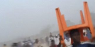 Relatives of those killed in Guinea stadium stampede recover bodies of loved ones